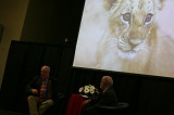 Rich Block shows photograph of lion cub.