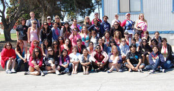 Photo of a group of students outside of their classroom.