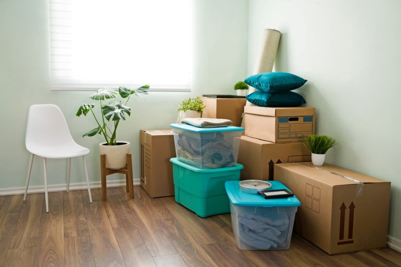 Moving boxes and room supplies on a floor