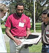 Faculty and students reviewing documents