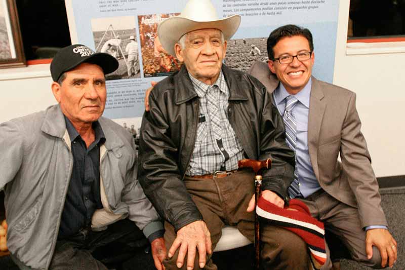 Professor Alamillo sitting with Former Ventura County Farm Workers