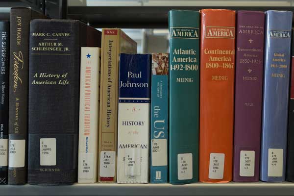 History books on a library shelf