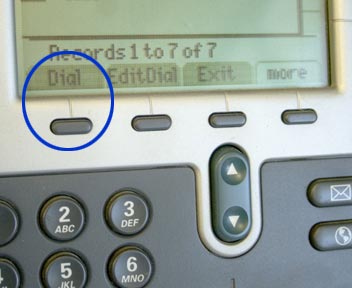 Dial button, first from the left and below the display screen