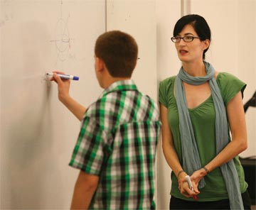 Professor Kathryn Leonard instructing a student
