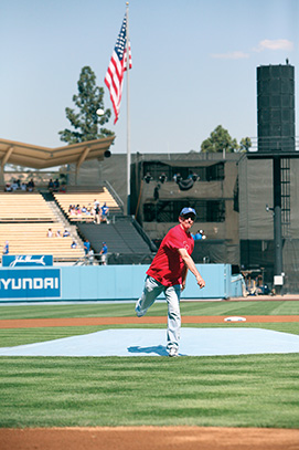 President Rush throwing the ceremonial first pitch at Dodger Stadium