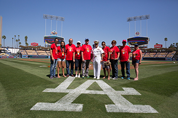 President Rush and Captain Larry Vasquez pose with members of the CI community, Union Bank, and Pacific Western Bank for a picture at Dodger Stadium in celebration of the 10th Annual Alumni & Friends Dodger Day.