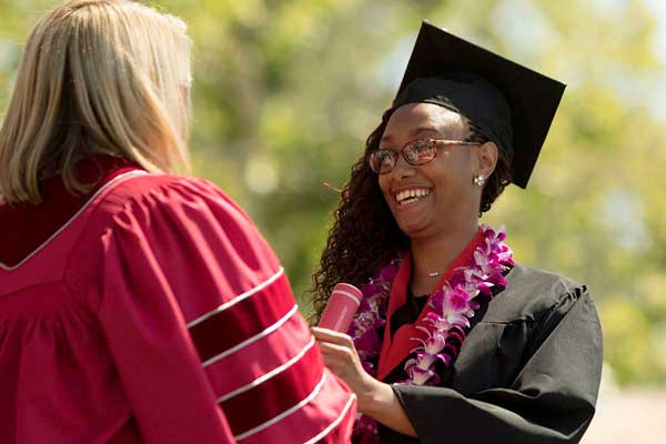 President Beck sees many student smiles at Commencement.