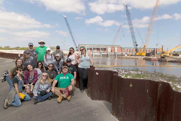 Attendees of the New Orleans Service-Learning Trip pose near the London Avenue Canal Temporary Flood Gates/Pump Station
