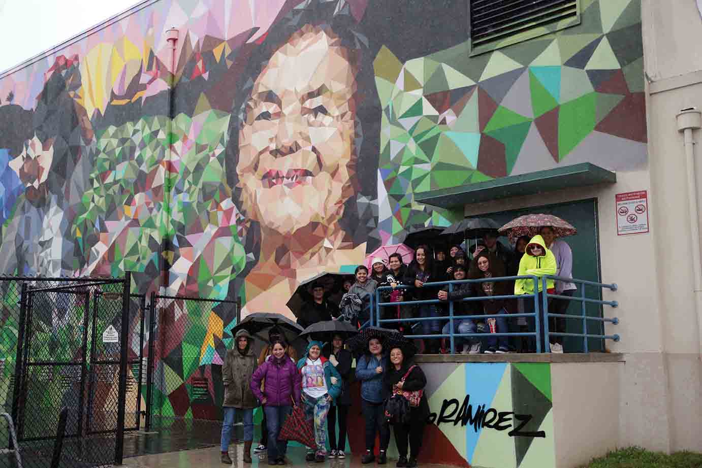 A student-organized bus tour included a stop at a Dolores Huerta mural in Ventura