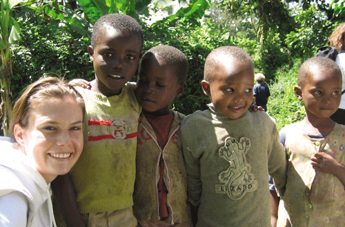 CSUCI Student Savanna Carson with four Tanzanian Children