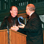 mark lisagor accepting an award from president rush