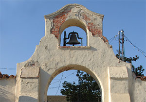 Older style church bell sits atop the steeple