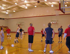 Student making a freethrow shot during a basketball game in the Recreation Center.