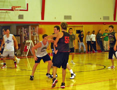 Students playing basketball in the Recreation Center.