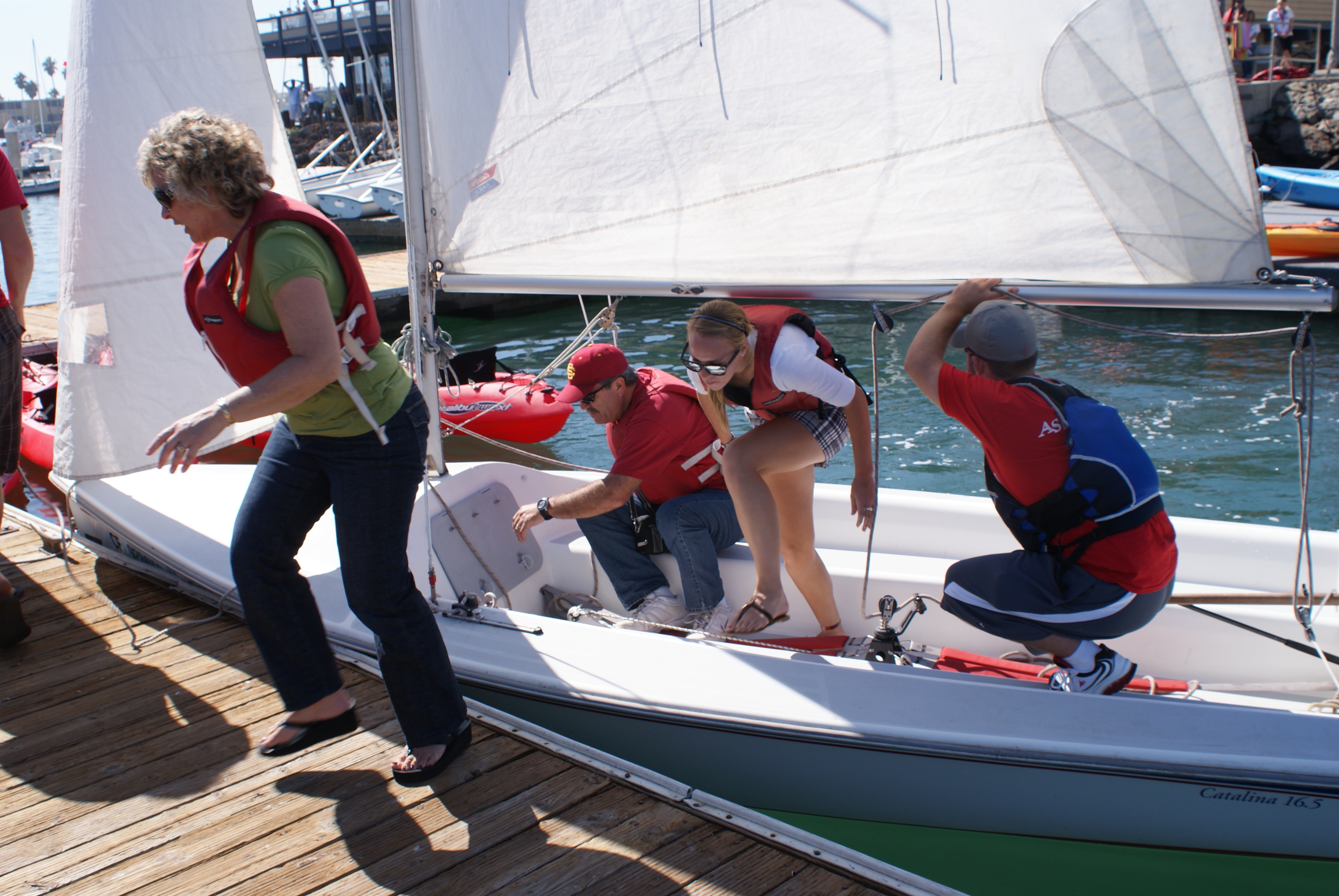 Students getting out of a sailboat