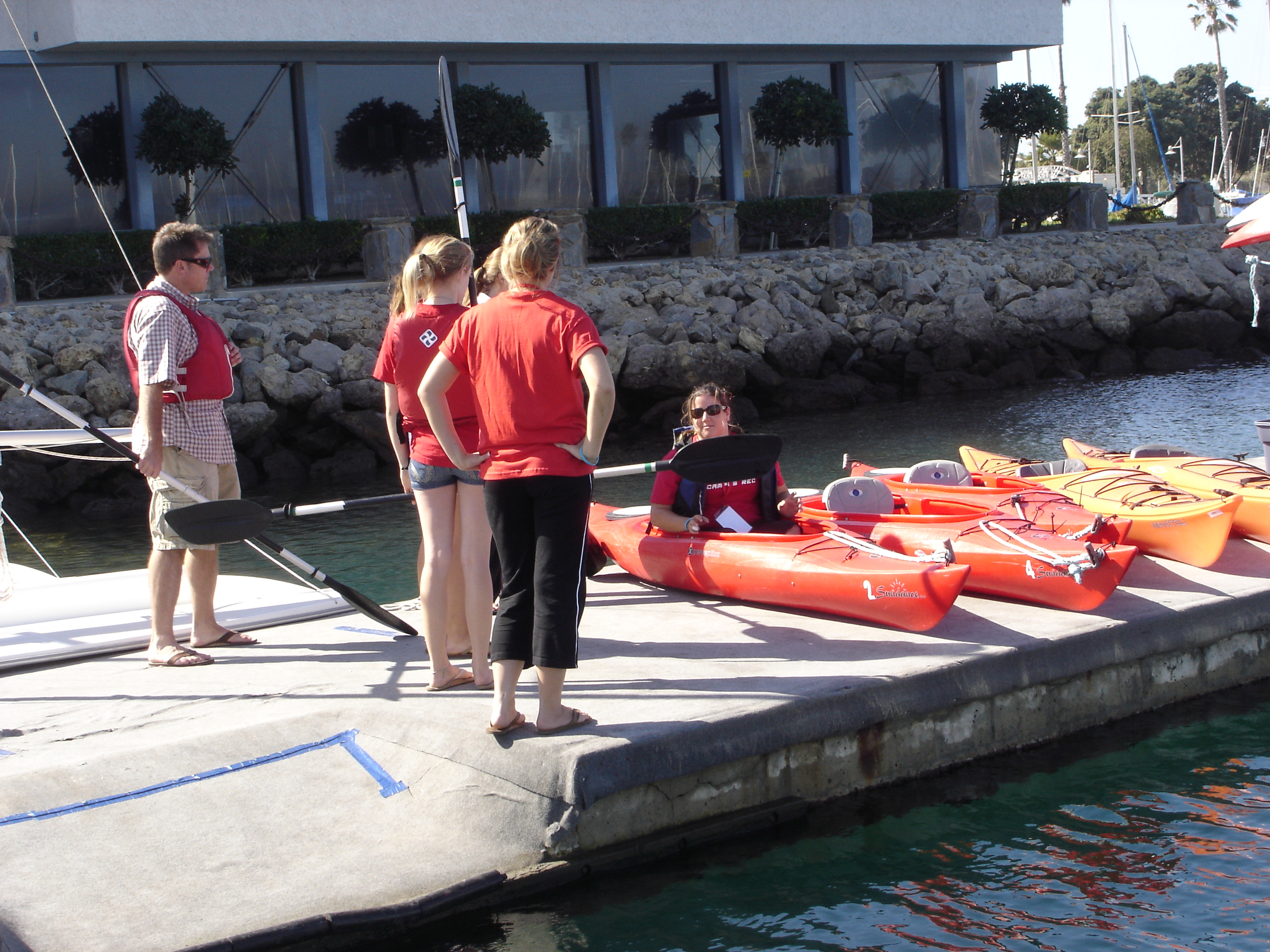 Students getting in to kayaks