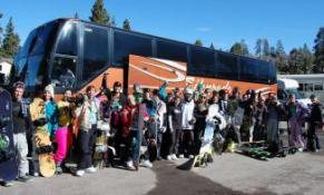 2011 Snow Club Trip to Big Bear group picture of charter bus with snow club members in Big Bear, CA