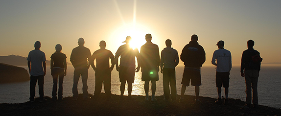 Image of people watching the sun set