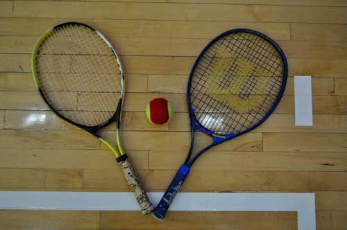 Two racquets and tennis ball