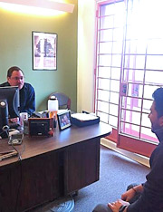 Photo of Jay Derrico, Veterans Affairs Program Coordinator, meeting with a student veteran.