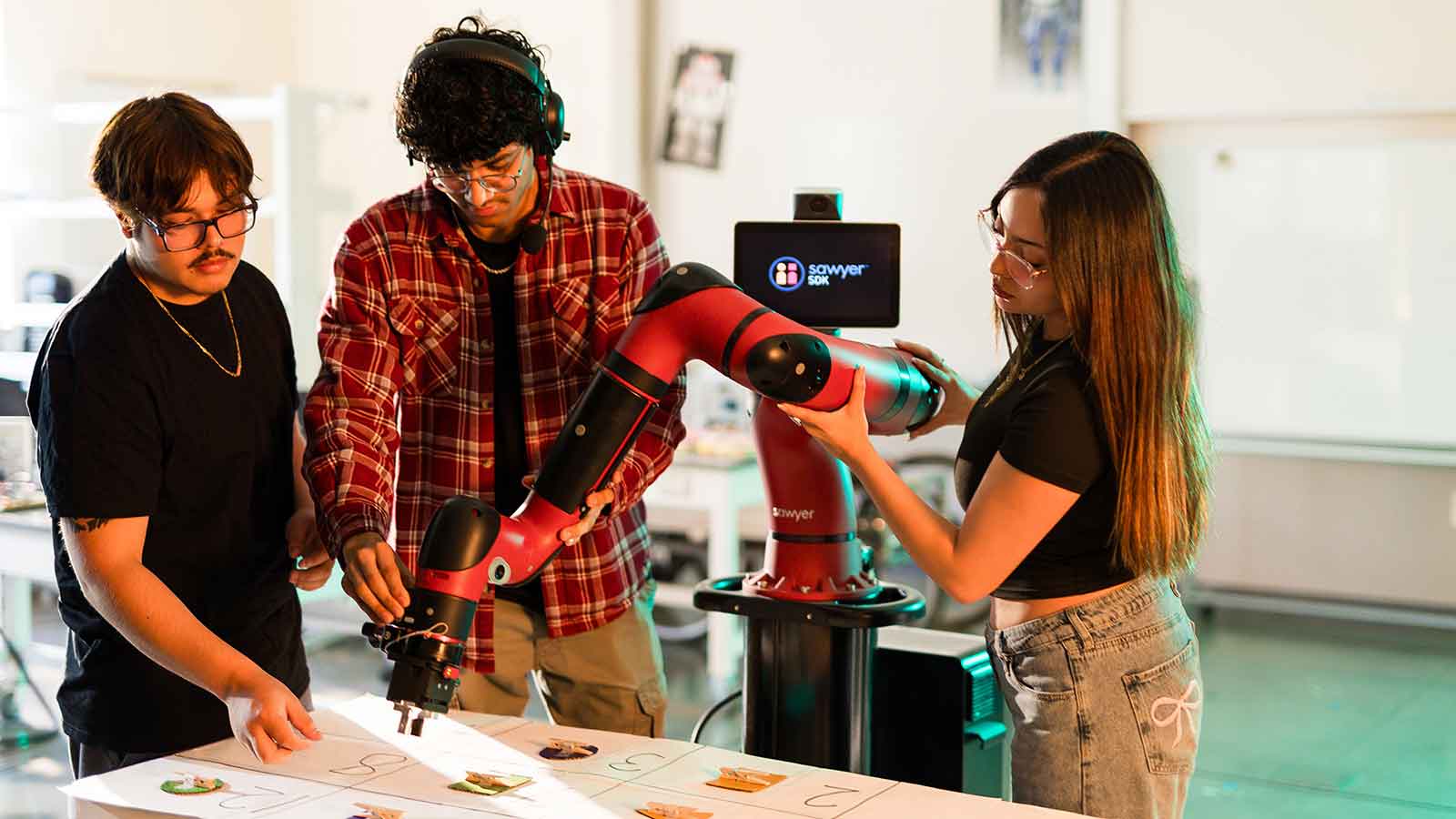 People working on robot