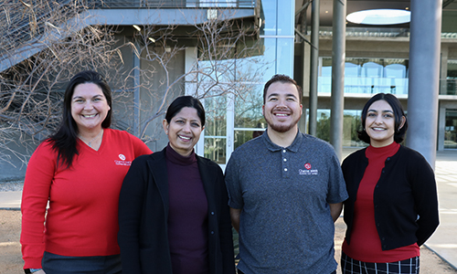Four Admission Counselors smiling for the camera