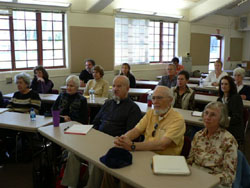 older people listening to a lecture