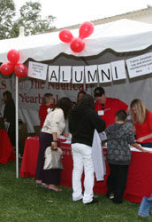 Alumni volunteers at table