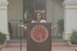 Photo of Elisabeth Freeman standing behind podium.