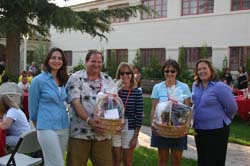Photo of happy parents with gift baskets