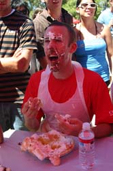 Photo of Student Brian McAleney getting pie on his face.