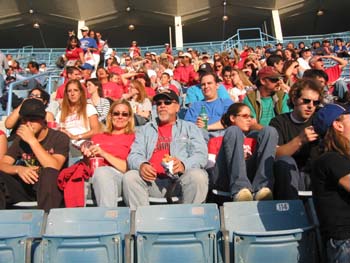 Group of alumni sitting at dodger day 2004