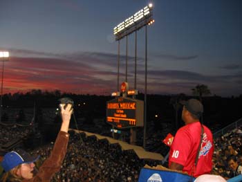 the sky, dodger stadium score board and a dodger stadium employee