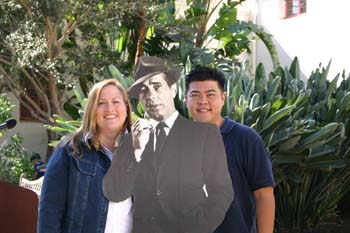 Two CSUCI alumni with a cardboard cutout