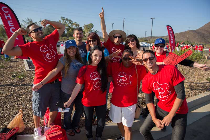 10 people wearing CI tshorts smiling for the camera