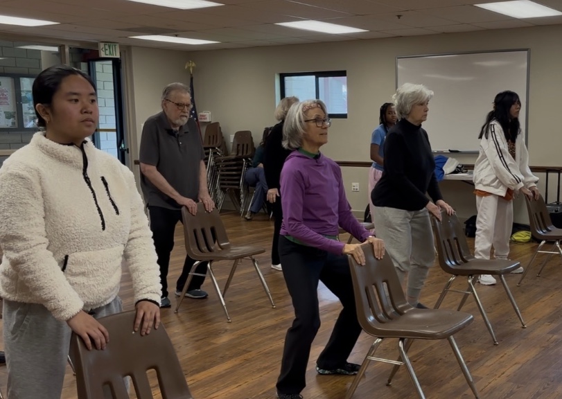 image of students dancing with older adults that have parkinson's disease