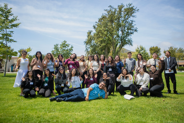 Professor with Capstone Class Outside in Lawn