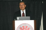 Dr. Sohn speaks at podium