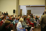 Audience eats at mixer prior to speaker event