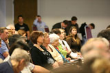 Goodall audience looks on attentively