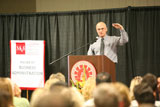 Puzder giving a speach to an audience