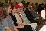 Audience members look on attentively