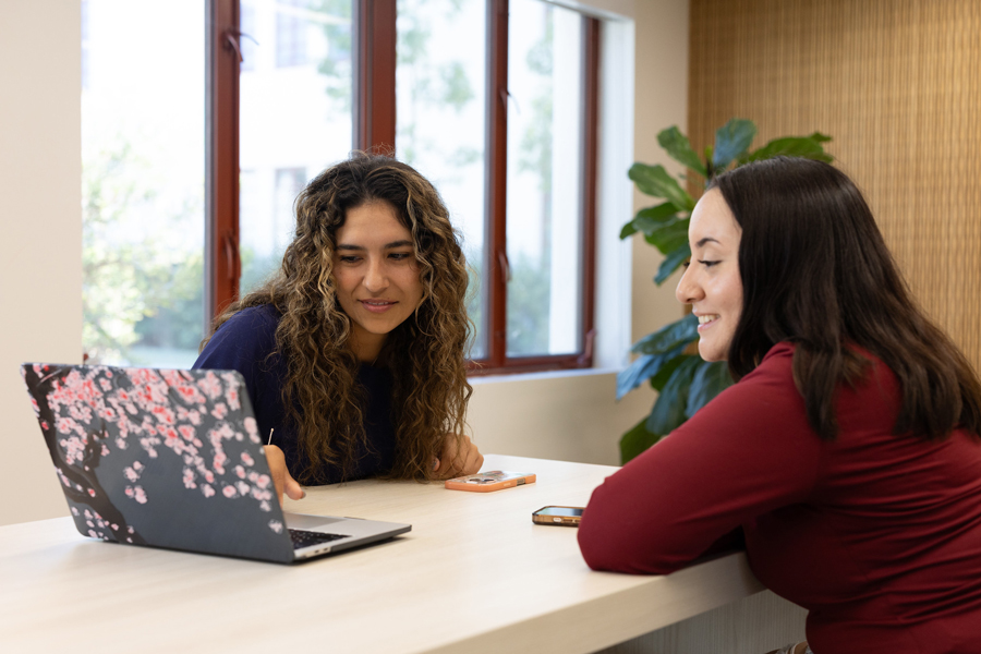 Two people getting a scholarship