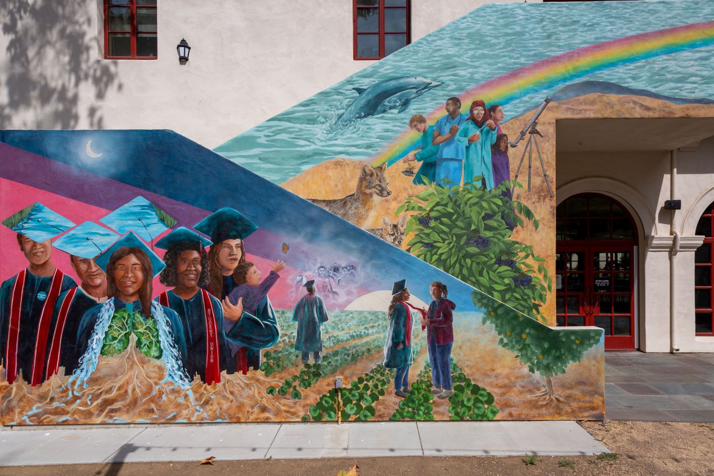 bottom left-8 students in cap and gown, 1 holding child, 3 standing in agriculture field-top right-dolphin coming out of water, 2 island foxes, 5 individuals with various outfits;medical scrubs, lab coat, telescope