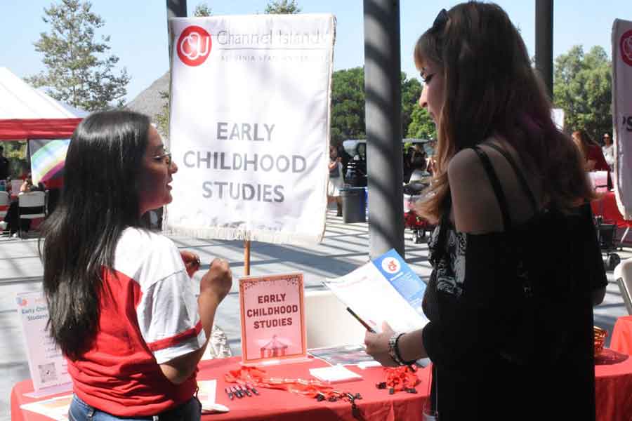 picture of ecs coordinator talking to student