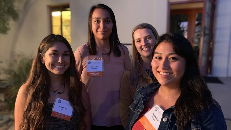 4 SOE members smiling for the camera