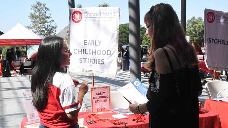 picture of ecs counselor talking to student