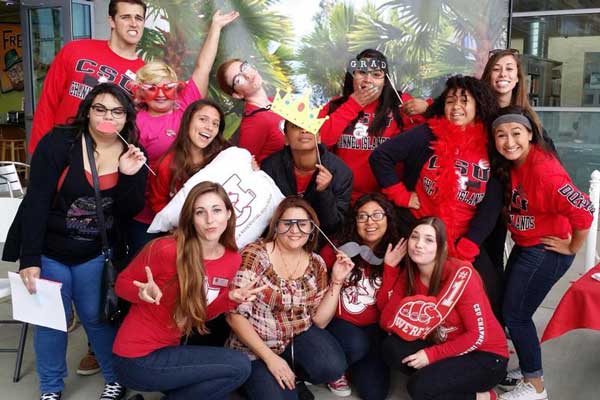 Student Assistants enjoying an on-campus photobooth.