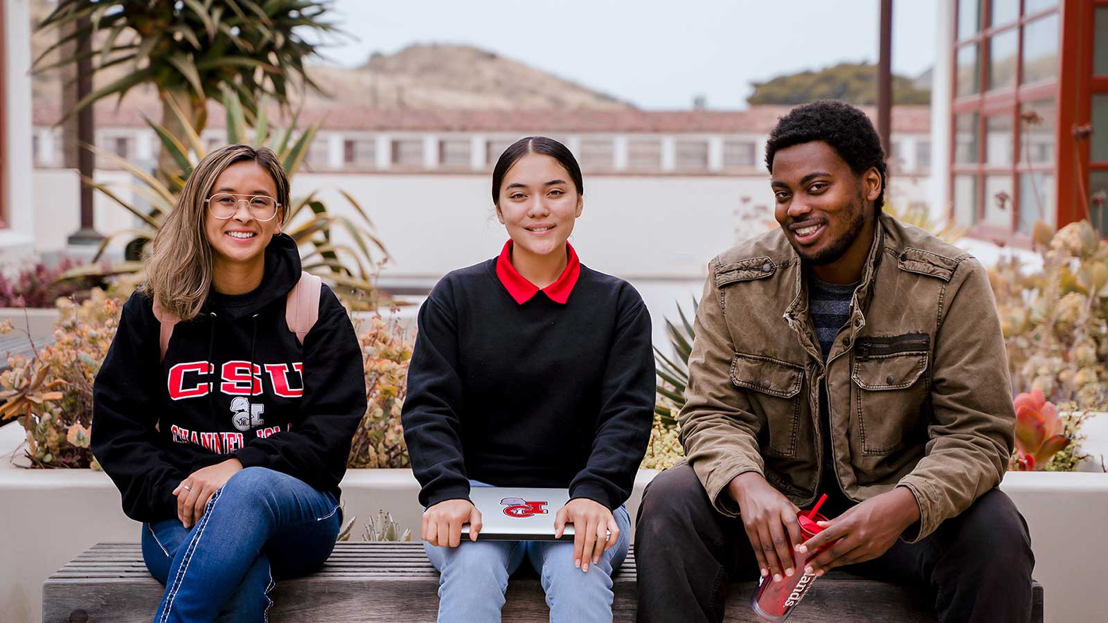 Students posing in front of bell tower