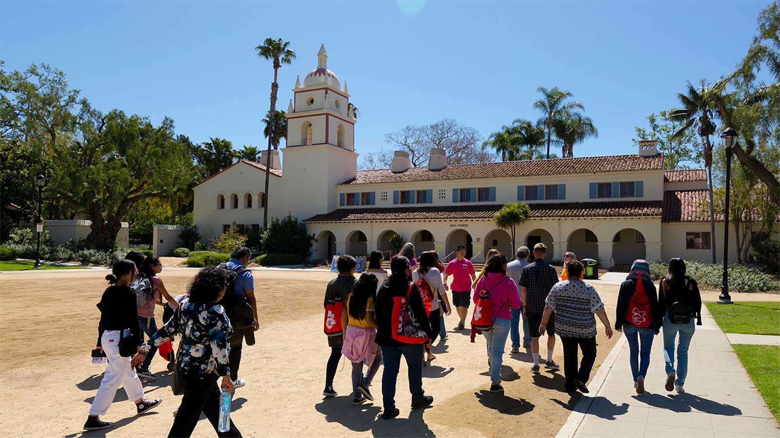 Group of students walking in front of Bell Tower